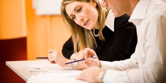 Lady and Gentelman with Papers and Pens